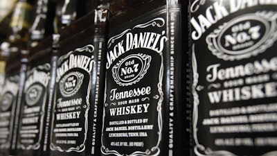 Bottles of Jack Daniel's Tennessee Whiskey line the shelves of a liquor outlet in Montpelier, Vt., Dec. 5, 2011.