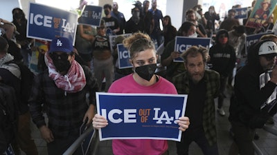 Protesters gather at the U.S. Department of Justice Federal Bureau of Prisons, Los Angeles, June 6, 2025.