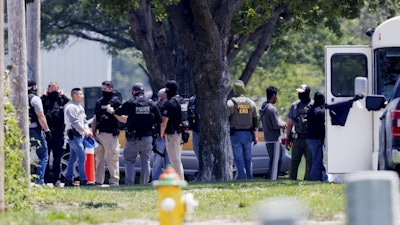 Federal agents are seen near Glenn Valley Foods in Omaha, Neb., June 10, 2025.
