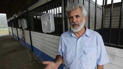Dr. Robert Malone gestures as he stands in his barn on his horse farm July 22, 2020, in Madison, Va.