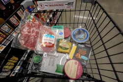 An assortment of vegan, organic, locally sourced and wild caught food products sit in a shopping cart at a grocery store in New Orleans, Wednesday, April 17, 2024.