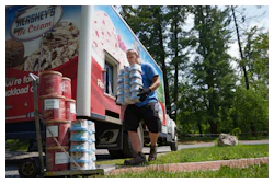 Hershey's Ice Cream delivery driver Sam Sattazahn delivers ice cream to Pine Grove Furnace general store, home of the half-gallon ice cream challenge, at Pine Grove Furnace State Park in Pennsylvania on Tuesday, June 10, 2025.