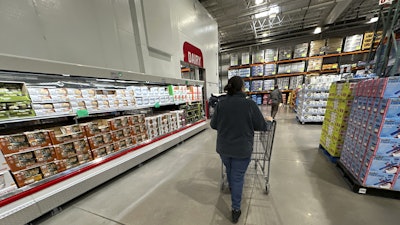 A shopper pushes a cart in a Costco warehouse, Jan. 23, 2025, Sheridan, Colo.