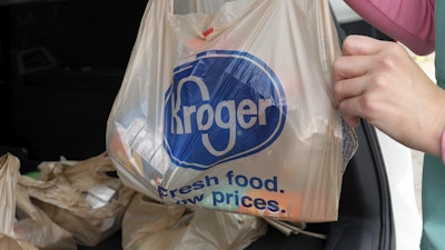 A customer moves purchases at a Kroger grocery store in Flowood, Miss., June 26, 2019.