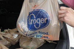 A customer moves purchases at a Kroger grocery store in Flowood, Miss., June 26, 2019.