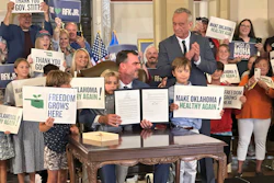 U.S. Secretary of Health and Human Services Robert F. Kennedy Jr. applauds after Oklahoma Gov. Kevin Stitt signs an executive order, Oklahoma City, June 26, 2025.