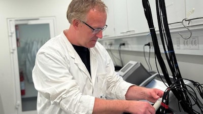 Associate Professor Christian Solem with a test tube with yogurt in the laboratory at the DTU National Food Institute.