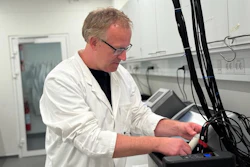 Associate Professor Christian Solem with a test tube with yogurt in the laboratory at the DTU National Food Institute.