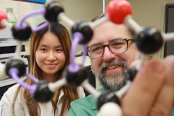 Study first author Yanxin Lin, left, and senior author Misha Kwasniewski examine the structure of the chemical catechin.