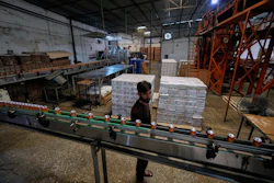 Employees of the Murree Brewery work at a soft drink production unit of the factory, in Rawalpindi, Pakistan, June 23, 2025.