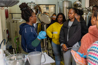Students prepare to brew beer with South African beer brewing master Apiwe Nxusani-Mawela, in Johannesburg, South Africa, June 5, 2025.