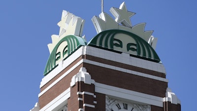 The Starbucks mermaid logo is displayed at the company's corporate headquarters in Seattle on April 26, 2021.