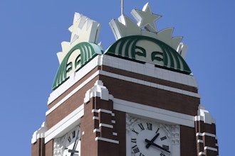 The Starbucks mermaid logo is displayed at the company's corporate headquarters in Seattle on April 26, 2021.