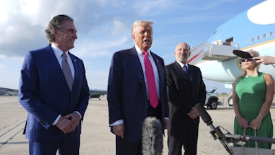 President Donald Trump speaks to the media after arriving at Joint Base Andrews, July 15, 2025.