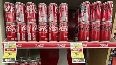 Coca-Cola cans are displayed at a grocery store in Mount Prospect, Ill., Thursday, July 17, 2025.