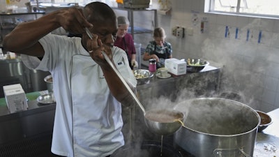A culinary student pours a cooked soup into a container, Johannesburg, South Africa, July 18, 2025.