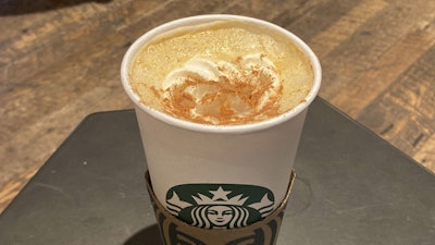 A Pumpkin Spice Latte drink rests on a table at a Starbucks in New York, Aug. 24, 2023.