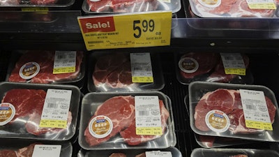A price for beef is displayed on a shelf at a grocery store in Mount Prospect, Ill., Thursday, July 17, 2025.