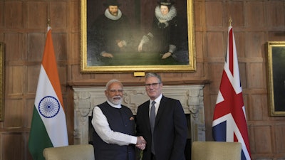 Britain's Prime Minister Keir Starmer welcomes Indian Prime Minister Narendra Modi at Chequers near Aylesbury, England, July 24, 2025.