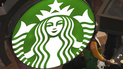 This is the Starbucks sign on Black Friday shoppers line at a Starbucks kiosk in the Walden Galleria in Buffalo, NY., Friday, Nov. 29, 2024.