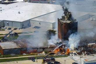 Firefighters battle a fire after an explosion in an industrial area in Fremont, Neb., Tuesday, July 29, 2025.