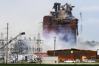 Firefighters battle a fire after an explosion in an industrial area in Fremont, Neb., Tuesday, July 29, 2025.
