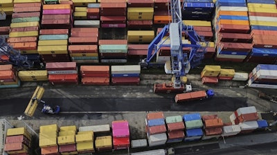 Containers are piled up in a cargo terminal in Frankfurt, Germany, Aug. 1, 2025.
