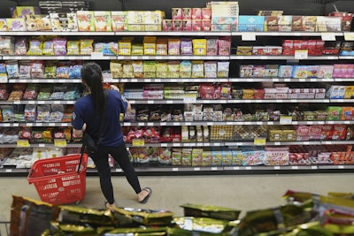 A customer buys Chinese made ginger candy at 99 Ranch Market, an Asian grocery store in Los Angeles, April 7, 2025.