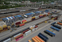 Shipping containers are loaded onto trucks at CSX Queensgate Rail Yard, May 7, 2025, Cincinnati.