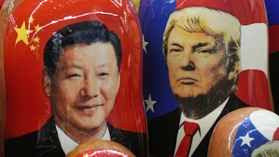 Russian Matryoshka dolls depicting China's President Xi Jinping and President Trump at a souvenir shop in St. Petersburg, Nov. 21, 2024.
