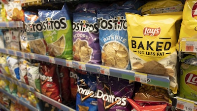 Potato chips are displayed at a store in New York, March 25, 2021.