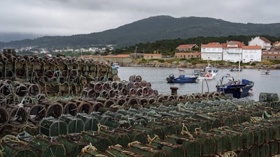 Octopus traps sit on the Port of Lira on Tuesday, June 24, 2025, in Lira, Spain, during an unusually long octopus fishing pause period.