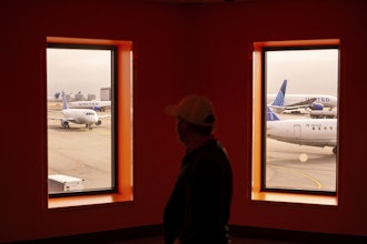 A traveler passes United Airlines planes at San Francisco International Airport on May 8, 2025, in San Francisco.