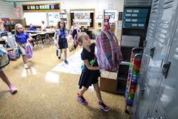 Savannah Knott hangs up her backpack for the day on the first day in her second grade classroom at Mary Carrico Catholic School, Tuesday, Aug. 12, 2025, in Knottsville, Ky.