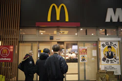 People stands outside a McDonald's store in Tokyo, March 15, 2024.