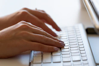 A person types on a keyboard on June 6, 2024, in Portland, Ore.