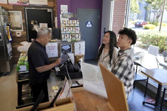 Braxton Kimura, right, orders food with his mother Carol Kimura at Vitality Bowl on Wednesday, Aug. 13, 2025, in San Jose, Calif.
