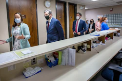 Health Director Lillian B. Koontz leads North Carolina Gov. Roy Cooper on a tour of the COVID-19 vaccine clinic at the Davidson County Health Department in Lexington, N.C., June 17, 2021.