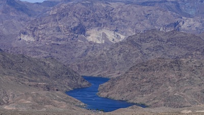 The Colorado River cuts through Black Canyon, June 6, 2023, near White Hills, Ariz.