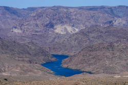 The Colorado River cuts through Black Canyon, June 6, 2023, near White Hills, Ariz.