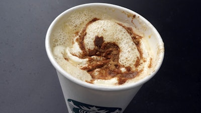 A Pumpkin Spice Latte drink rests on a table at a Starbucks in New York, Aug. 24, 2023.