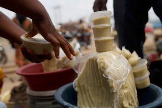 People buy shea butter on a street, in Abuja, Nigeria, Thursday, Aug. 28, 2025.