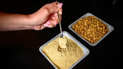 A tray of modified brewer’s yeast (left) and the dog kibble used in the feeding study at Illinois.