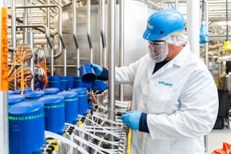 Nelson-Jameson's Shane Krieger, lifting the cover off an Alfa Laval ThinkTop Valve.