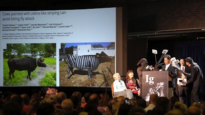 The Ig Nobel Prize for biology is accepted by Tomoki Kojima, Kazato Oishi, Yasushi Matsubara, Yuki Uchiyama, Yoshihiko Fukushima, Naoto Aoki, Say Sato, Tatsuaki Masuda, Junichi Ueda, Hiroyuki Hirooka and Katsutoshi Kino, Boston, Sept. 18, 2025.