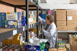 Phylis Allen organizes supplies at Neighbor's Cupboard in Winterport, Maine, on Tuesday, Aug. 26, 2025, a food pantry that she has helped run for the past 17 years.