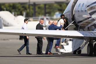 Harjinder Singh is escorted onto an airplane by Florida Lt. Gov. Jay Collins and law enforcement, Aug. 21, 2025, Stockton, Calif.