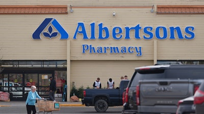 Shoppers head into an Albertson's grocery store, Nov. 23, 2024, Cheyenne, Wyo.
