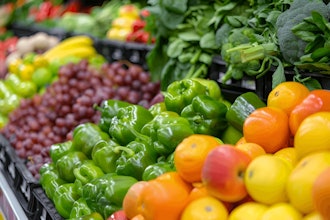 Fruits and vegetables lined up at a grocery store.