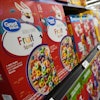 A customer walks past a display of Great Value brand cereal at a Walmart Neighborhood Market, Friday, Sept. 26, 2025, in Bentonville, Ark.